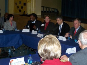 Tech High Principal Elisa Falco (far left) listens as U.S. Senator Johnny Isakson (far right) introduces U.S. Secretary of Education Arne Duncan (second from right).